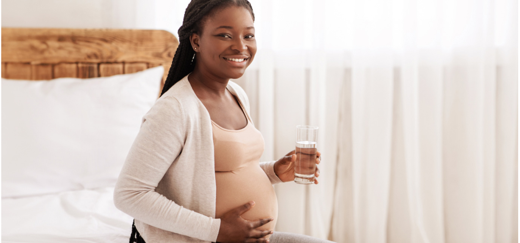 Drinking water during your pregnancy Expecting mama drinking water